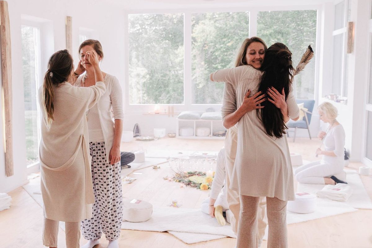 Women embracing after a ceremony